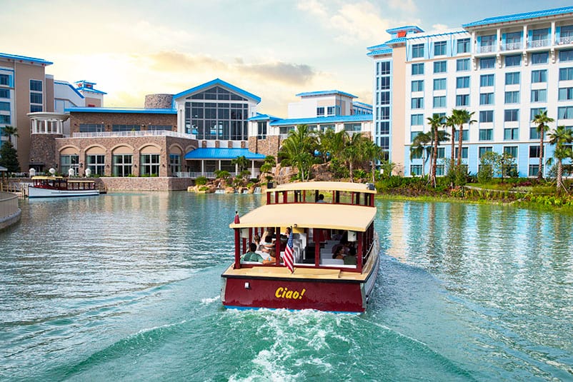 A water taxi cruises towards Loews Sapphire Falls Resort, an on site resort hotel at Universal Orlando Resort.