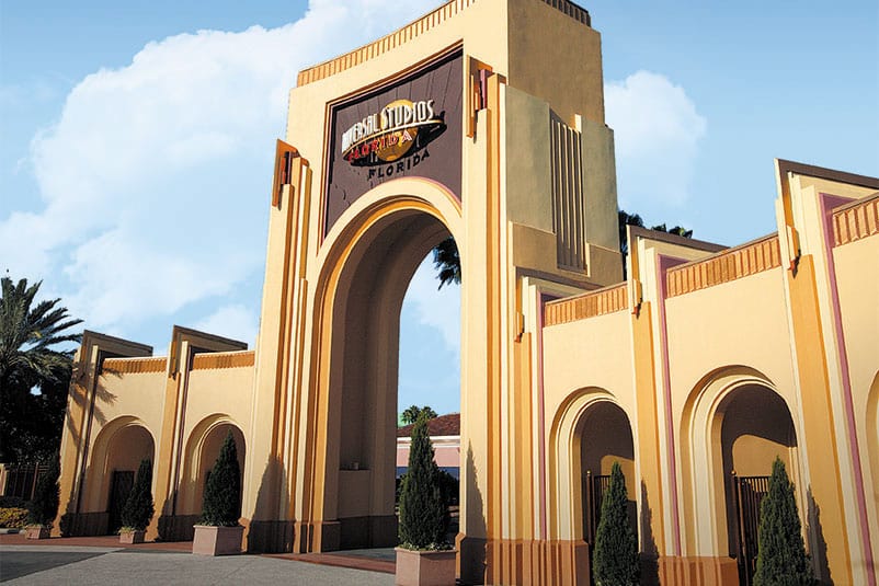  A regal, old Hollywood style arch that serves as the entrance to Universal Studios Florida, a theme park located in Orlando.