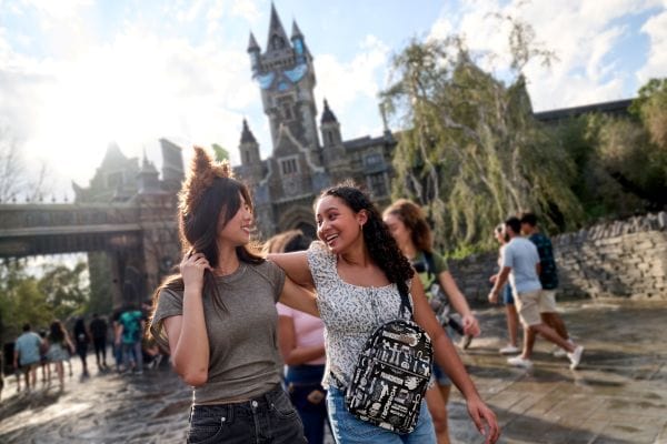 Two girls walking through Dark Universe at Universal Epic Universe.