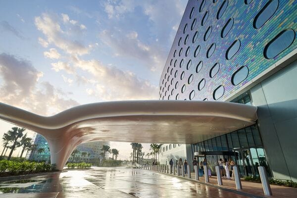Universal Terra Luna resort exterior entrance with guests walking in.