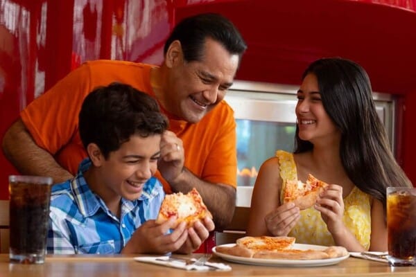 Family enjoying Pizza at Red Oven Pizza Bakery.