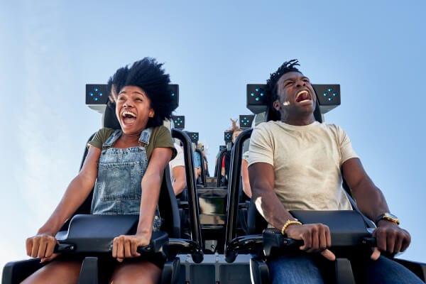 Couple screaming while riding in the very front of the Velocicoaster in the Jurassic Park area at Universal's Islands of Adventure