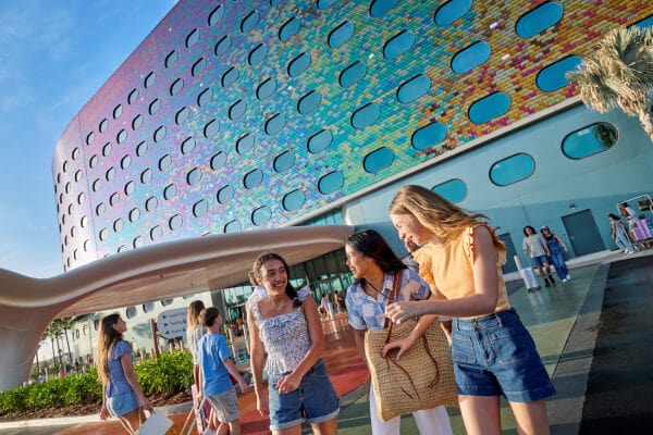 People walking near the front entrance of Universal Terra Luna Resort.