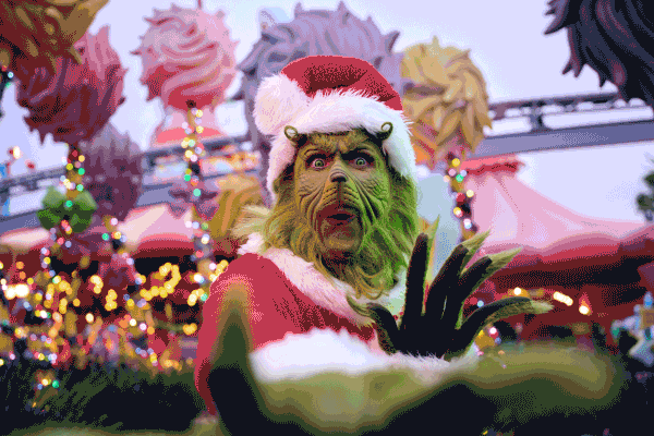 The Grinch in Santa gear, Guests celebrating with holiday elves, and Hogwarts Castle lit up at night.