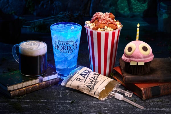 Crystal Lake Coffee next to a blue drink, Clown Cafe Bloody Popcorn and a chocolate cupcake with a RadWay mocktail
