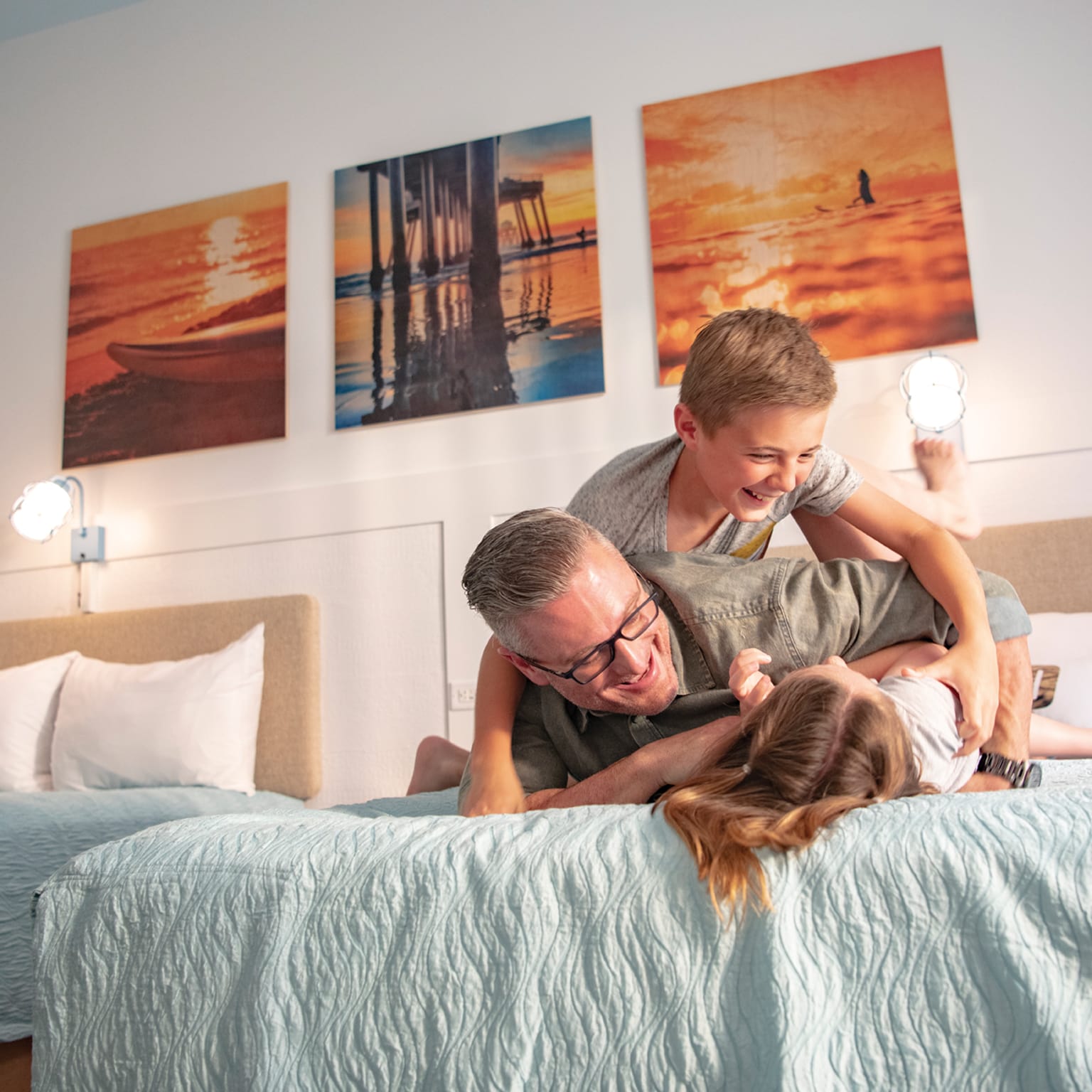 A family enjoy time in their 2-bedroom suite at Universal's Endless Summer Resort - Dockside Inn and Suites.