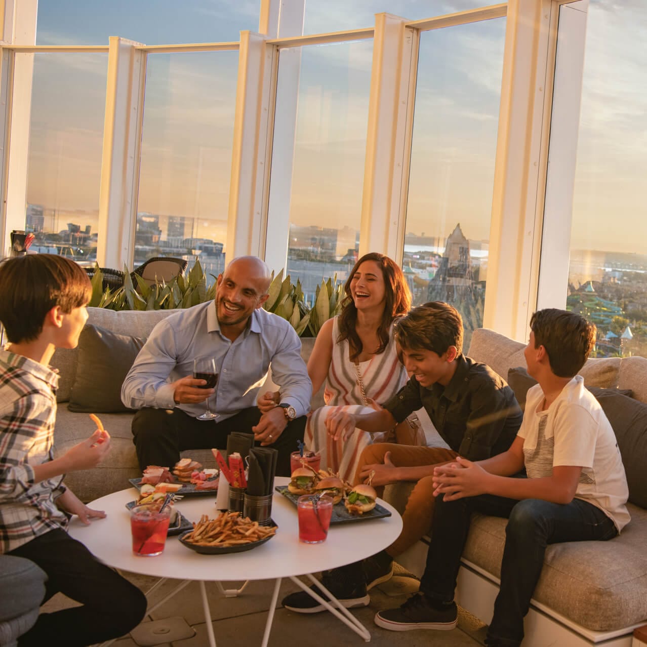 A family dining at the rooftop restaurant at Universal's Aventura Hotel.