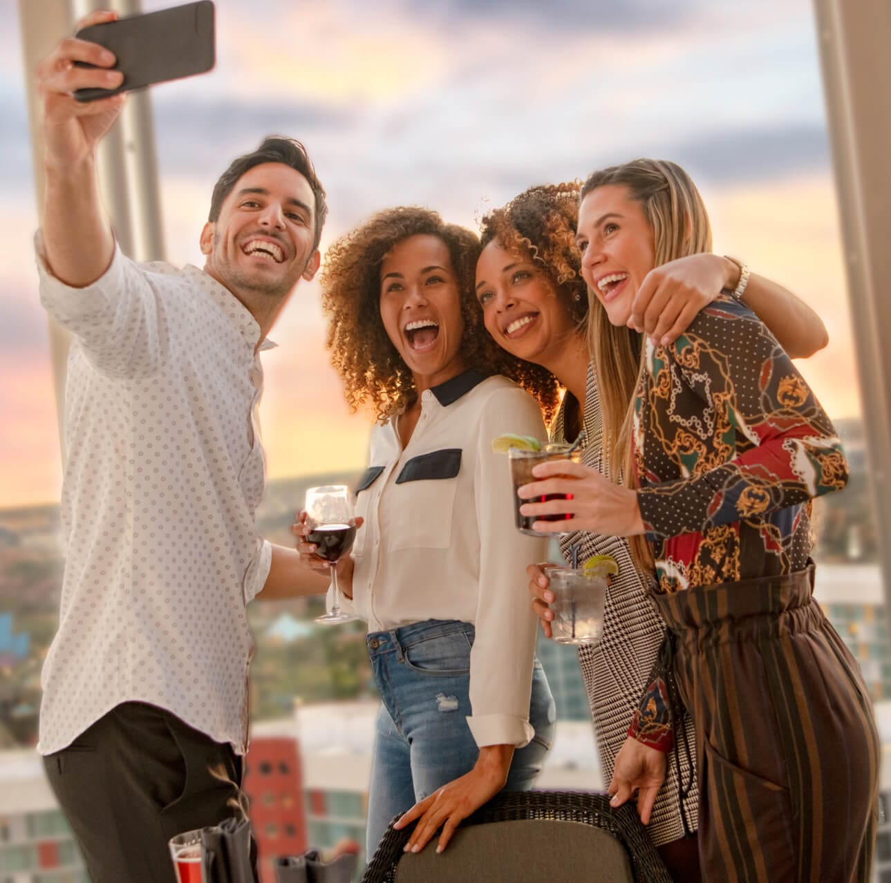 Friends enjoying rooftop dining at Universal's Aventura Hotel