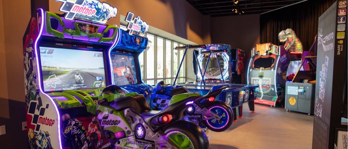 A group of lighted arcade games.