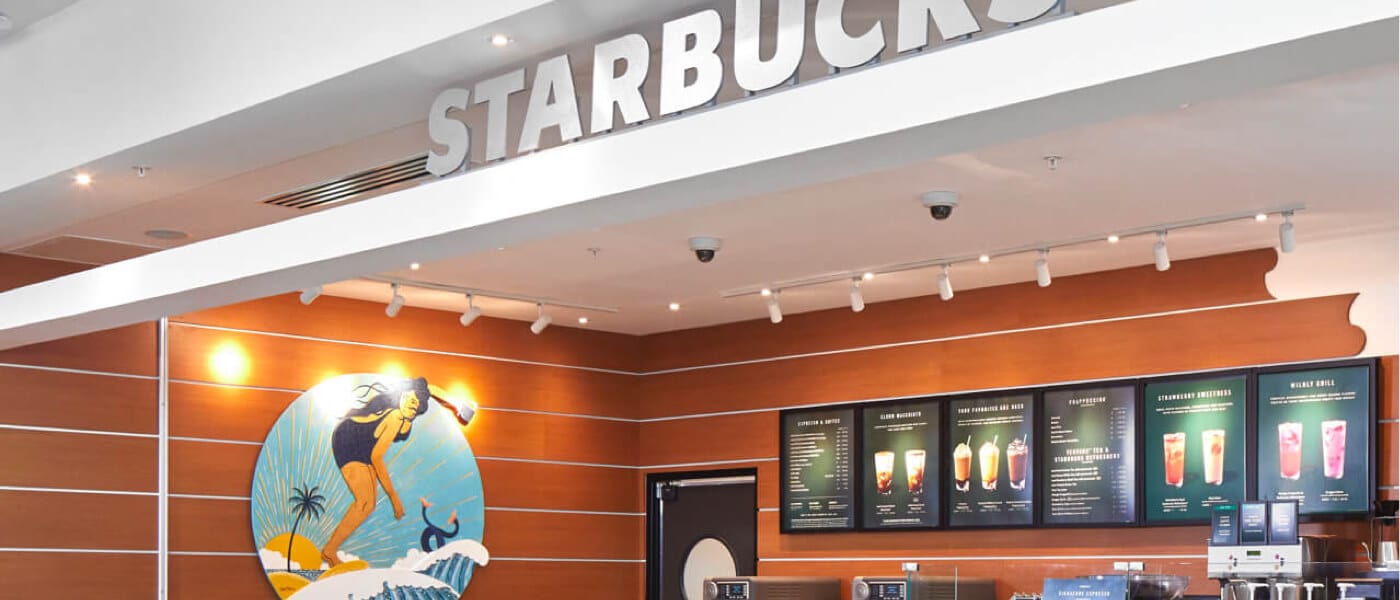 A Starbucks in the lobby of Universal Endless Summer Resort - Dockside Inn & Suites.