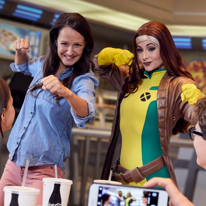 Rogue poses with a fan at the Marvel Character Dinner at Universal’s Islands of Adventure.