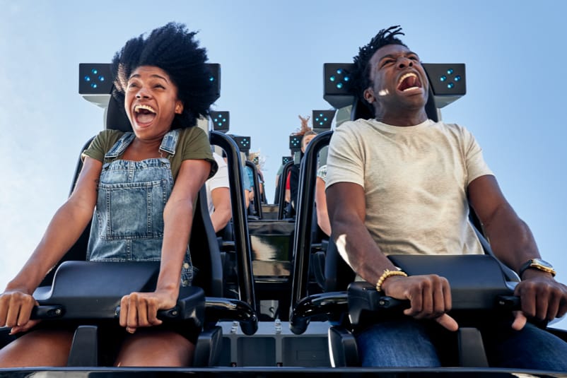 Couple screaming while riding in the very front of the Velocicoaster in the Jurassic Park area at Universal’s Islands of Adventure