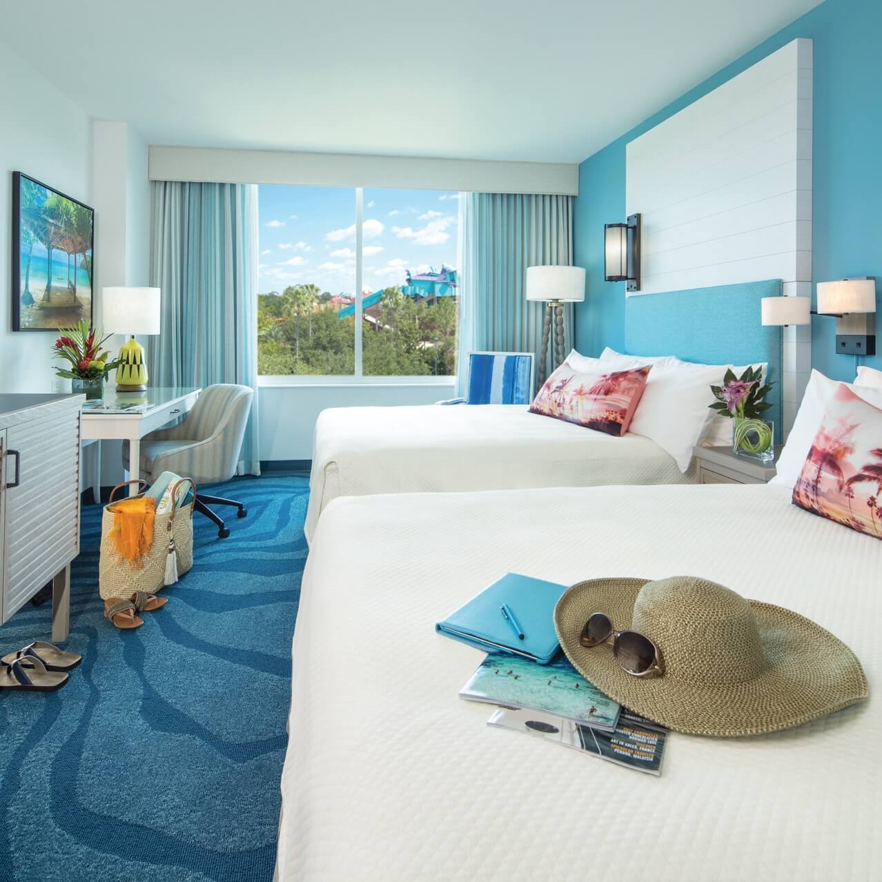 A guest room with two queen sized beds at Loews Sapphire Falls Resort, Universal Orlando's Caribbean themed on site hotel. 