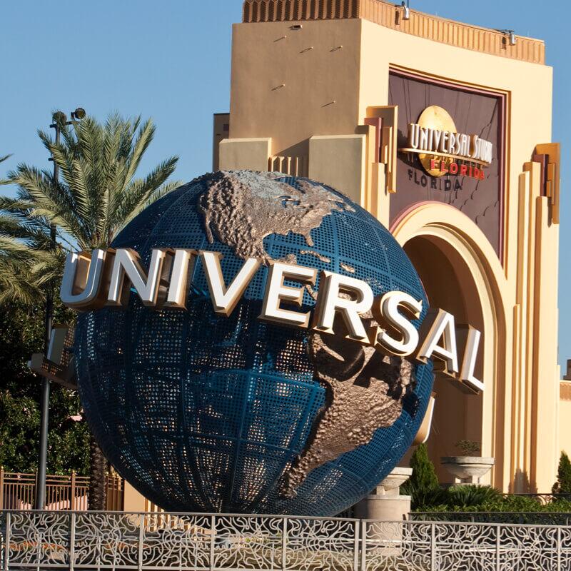 Universal Orlando Resort Globe with the Universal Studios Florida arches behind it.