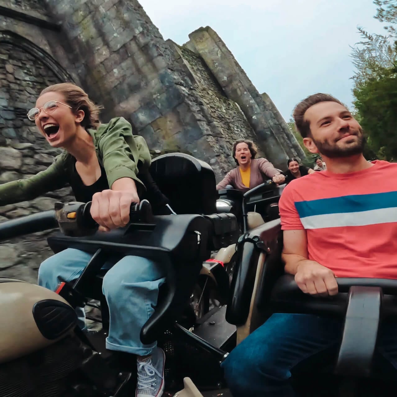 The McLaughlin family screams in delight while riding Hagrid’s Magical Creatures Motorbike Adventure™ at Universal s Islands of Adventure.