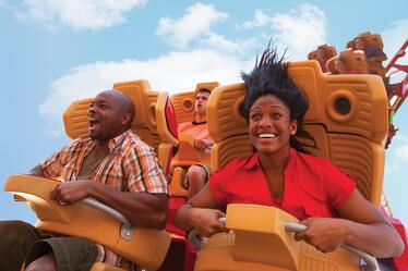 A man and woman shriek with excitement on Hollywood Rip Ride Rockit roller coaster at Universal Studios Florida.