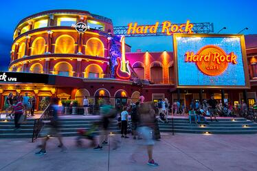 The exterior of the Hard Rock Live building illuminated at night at Universal CityWalk.
