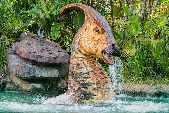 Jurassic Park River Adventure Fast Fact image 1, a dinosaur poking its head out of the water.