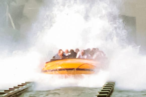 Jurassic Park River Adventure Fast Fact image 1, featuring a boat splashing through the water.