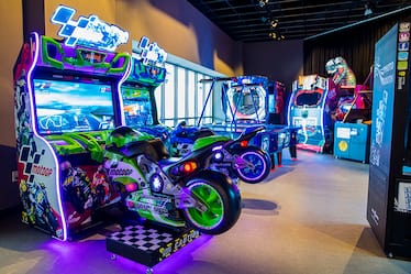 A group of lighted arcade games.