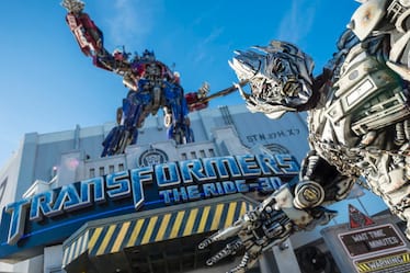 Megatron is one of the TRANSFORMERS characters that you can meet outside of TRANSFORMERS: The Ride 3D at Universal Studios Orlando. Megatron stands in front of a statue of Optimus Prime at the entrance to TRANSFORMERS: The Ride 3D at Universal Studios Florida in Orlando.