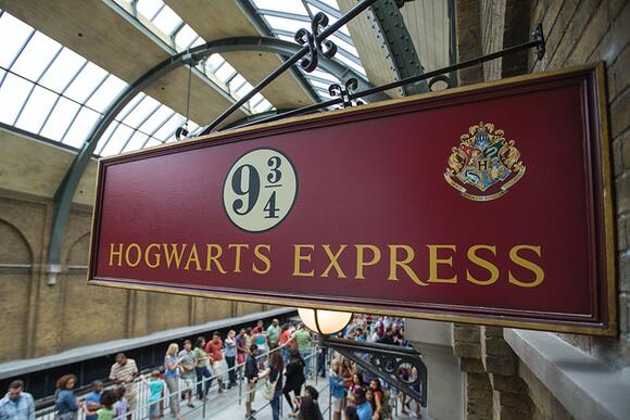 Hogwarts Express King's Cross Station Fast Facts Image 2 of the interior train station sign inside the station platform area.