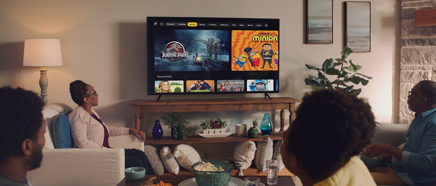 A family using Peacock to watch the movies that inspired rides and attractions at Universal Orlando Resort.