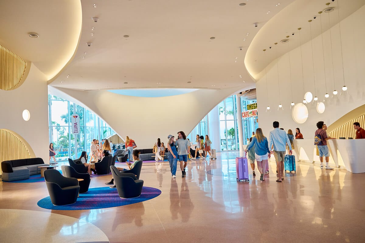 Guests checking in and enjoying the spacious lobby area of Universal Terra Luna Resort.