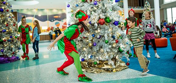 Kids and elves meet in the festive lobby of Universal's Cabana Bay Beach Resort.